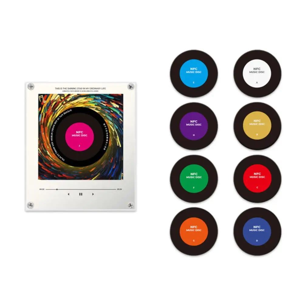 Clear acrylic NFC music player with colorful album art, alongside eight small, round, customizable NFC music discs in various colors.