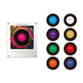 Clear acrylic NFC music player with a colorful album art display and eight customizable, round NFC music discs in various colors.